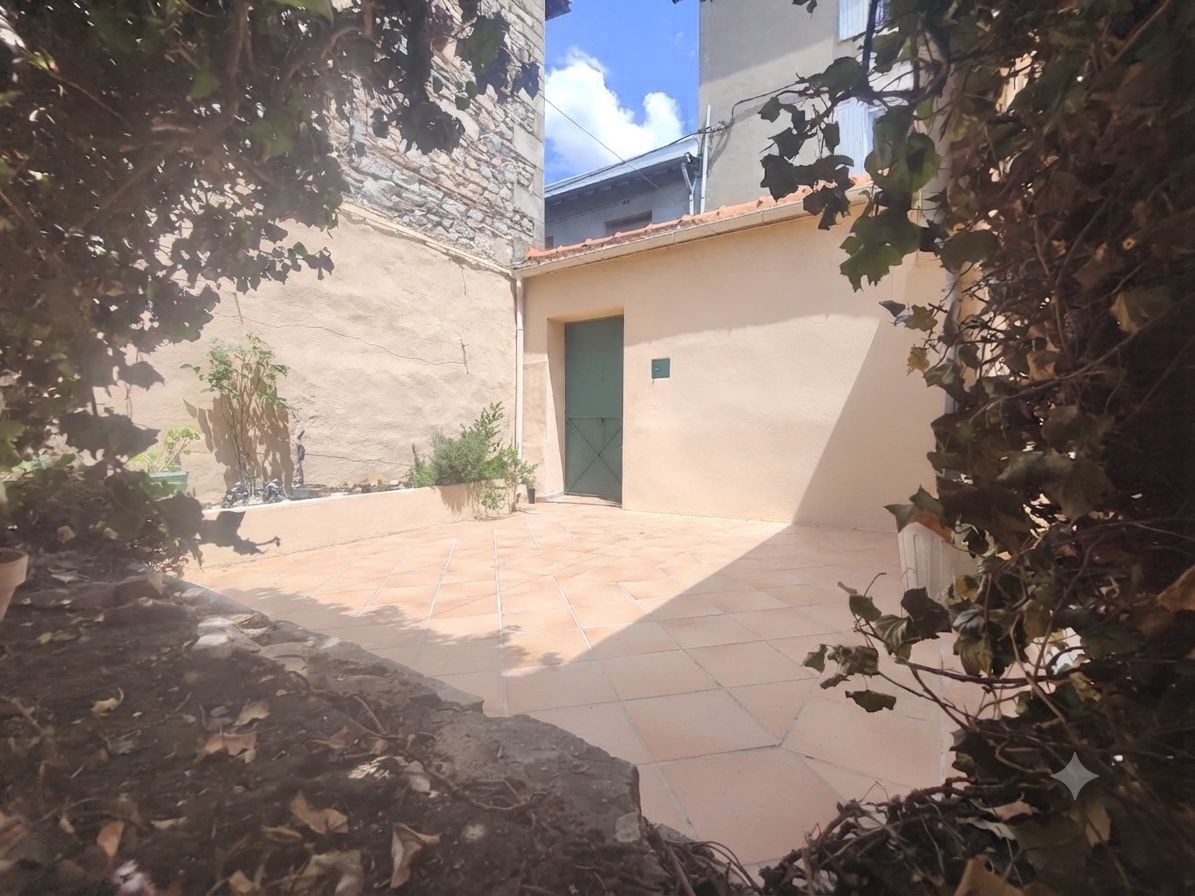 Maison de ville de plain pied avec cour intérieure 